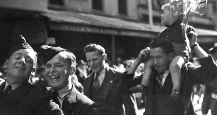 B&W image of 4 soldiers participating in the VJ Day procession 1945