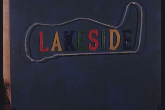Title card from home movie showing the word 'Lakeside' arranged in plastic colour letters