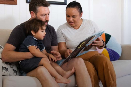 Family reading inside
