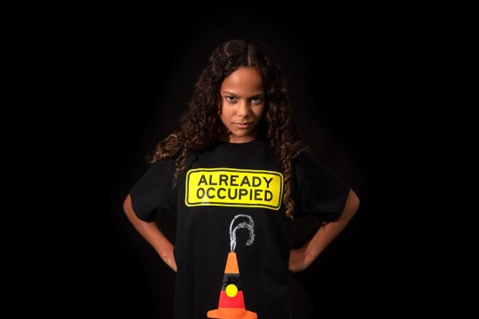 Shiloh Nakach wearing a Libby Harward designed "Already Occupied" shirt.