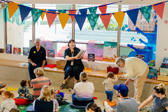 Children gather around at Storytime, at State Library