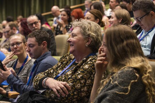 Teachers seated in auditorium, 2025 Curriculum Connect Symposium