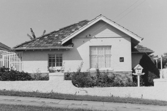 Black and white photo of single level house in Newmarket.