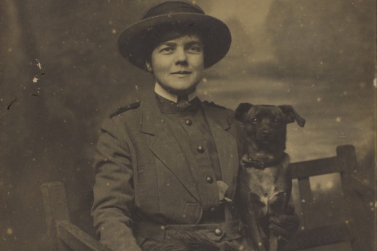 Studio portrait of Nurse Constance Keys with one of her pet dogs, ca. 1918, John Oxley Library, State Library of Queensland, Image 30674-0005-0051
