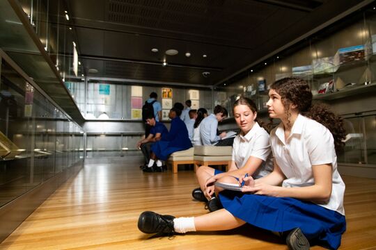 Students at the Australian Library of Art Showcase, level 4, State Library of Queensland.