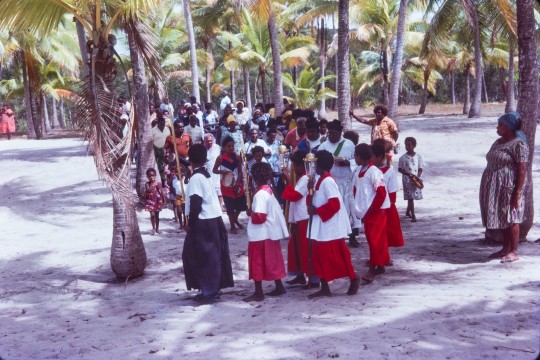 The people of Badu prepare for the Coming of the Light parade in Badu Island, Torres Strait in the late 1970s. 