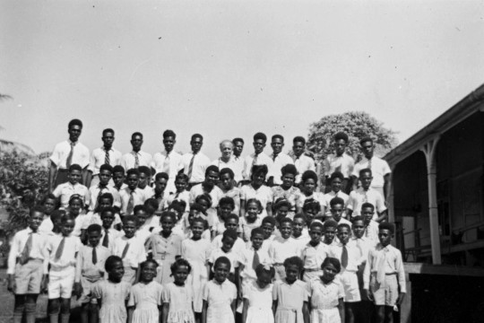 A group of Torres Strait Islander children standing outside