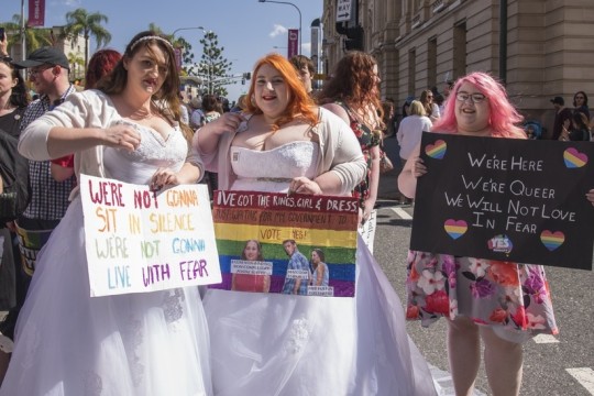 Demonstrators wearing wedding gowns at Marriage Equality Rally Brisbane