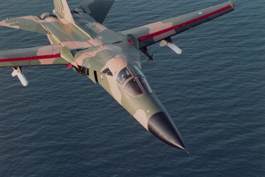 F-111 Strike aircraft on a training run over the ocean, Queensland, 1989