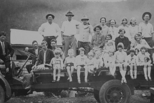 Photograph of three Mackay families sitting on a truck