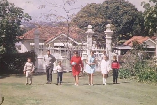 Family arriving for a backyard picnic