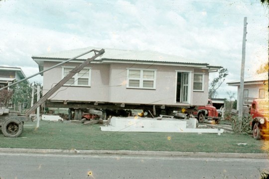 House being jacked up for removal, ca1959, Charles Busch, John Oxley Library, SLQ, MMS ID 99183339720702061