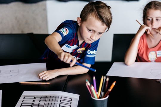 Boy using a pencil