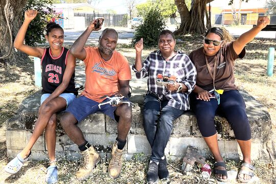 Drone Essentials workshop participants celebrate getting their drone certification at the Studio IKC in Kowanyama
