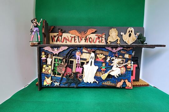 A photo of a miniature haunted house