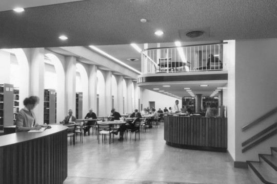 Interior of State Library in about 1975 showing people reading and women at information desk