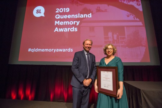 Kattie Pittock accepting the John Oxley Library Award on behalf of Paul Lyons. 2019 Queensland Memory Awards.