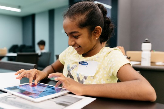 Girl playing with tablet