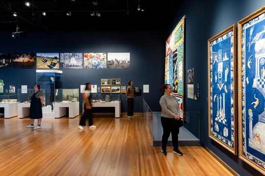 Wide view of visitors exploring the Dearly Departed exhibition.