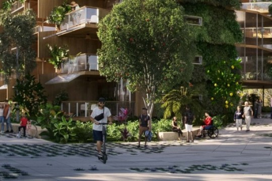 Image of urban area with apartment buildings, greenery and people