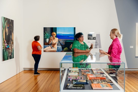 Visitors viewing artwork inside the Meet the artisits' exhibition space.