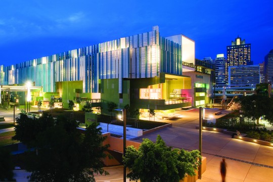 State Library of Queensland building lit up at night