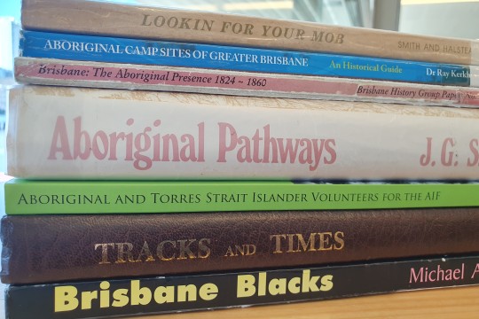 Stack of books relating to First Nations peoples