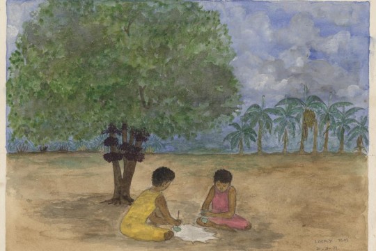 Two children sitting under a tree playing with spinning tops