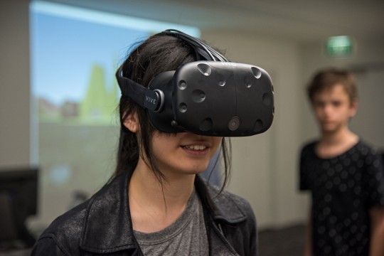 Young person using a VR headset.