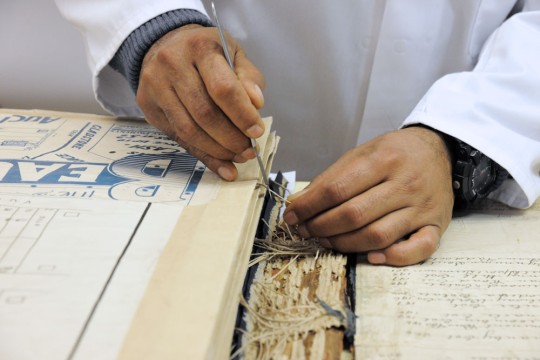 State Library of Queensland staff member preserving Blocksidge collection.