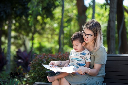 Mother and son reading at the park