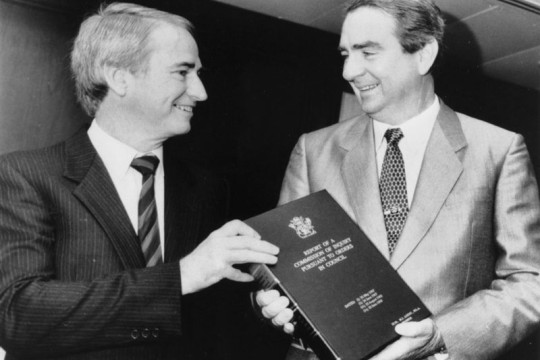 Tony Fitzgerald handing a copy of the Fitzgerald Report to Premier Mike Ahern, 1989