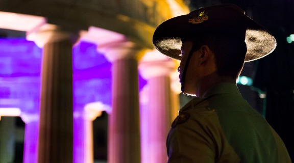 A Young soldier standing during the Anzac Day dawn service in Brisbane, Queensland, 2014