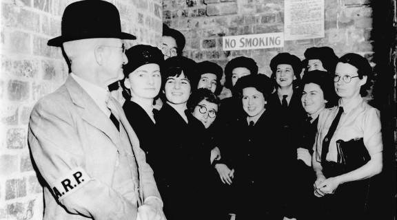 Air raid warden and members of the W.A.A.F in a Brisbane air raid shelter, 1942’