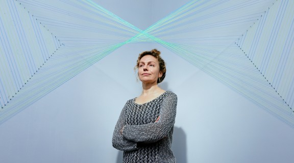 Photograph of artists Sandra Selig in her Ferny Grove studio, by Joe Ruckli.