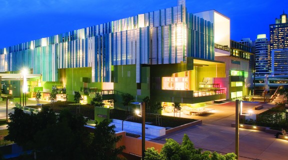 State Library of Queensland building lit up at night