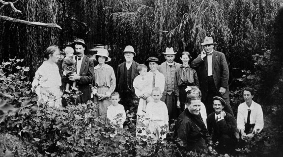Portrait of the Morrow family taken outdoors in a rainforest setting at Gatton.