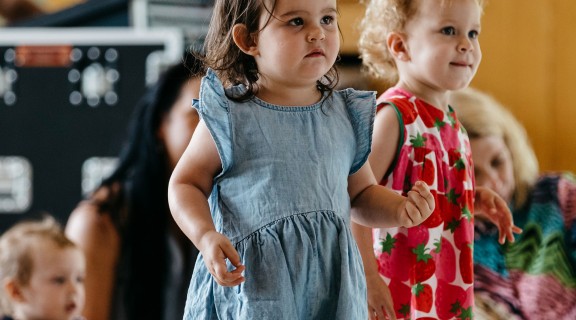 Two girls dancing at Rhyme Time. on the Queensland Terrace.