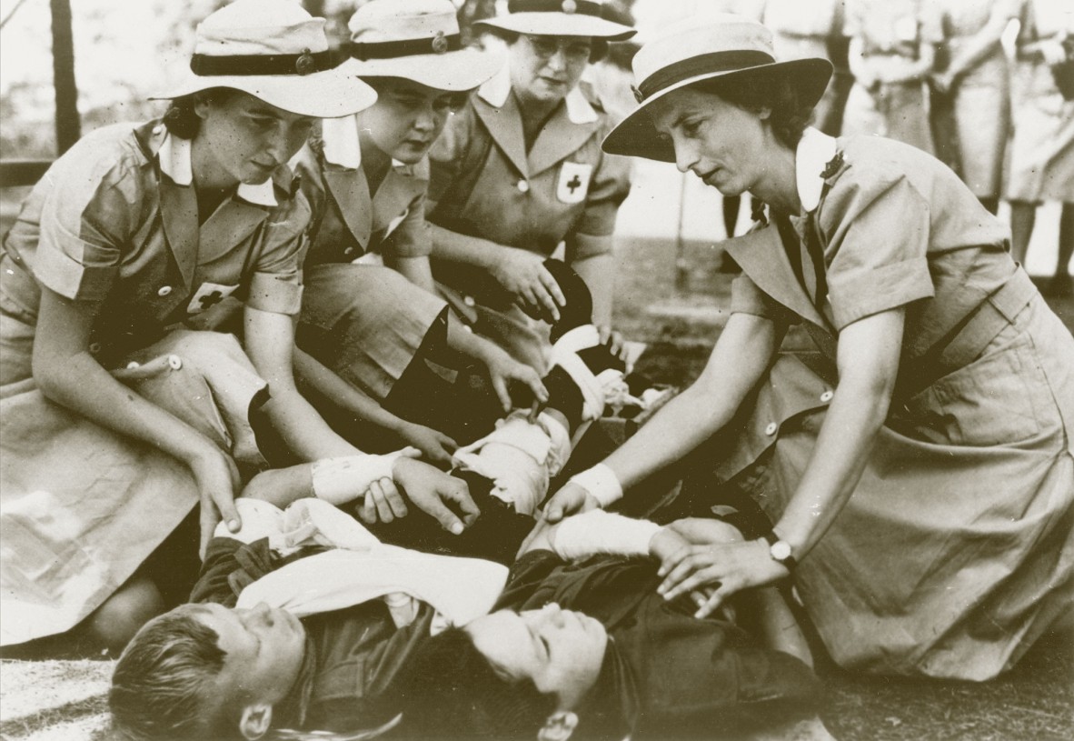 4 women Voluntary Aid Detachment members in first aid training, Brisbane, ca. 1942.