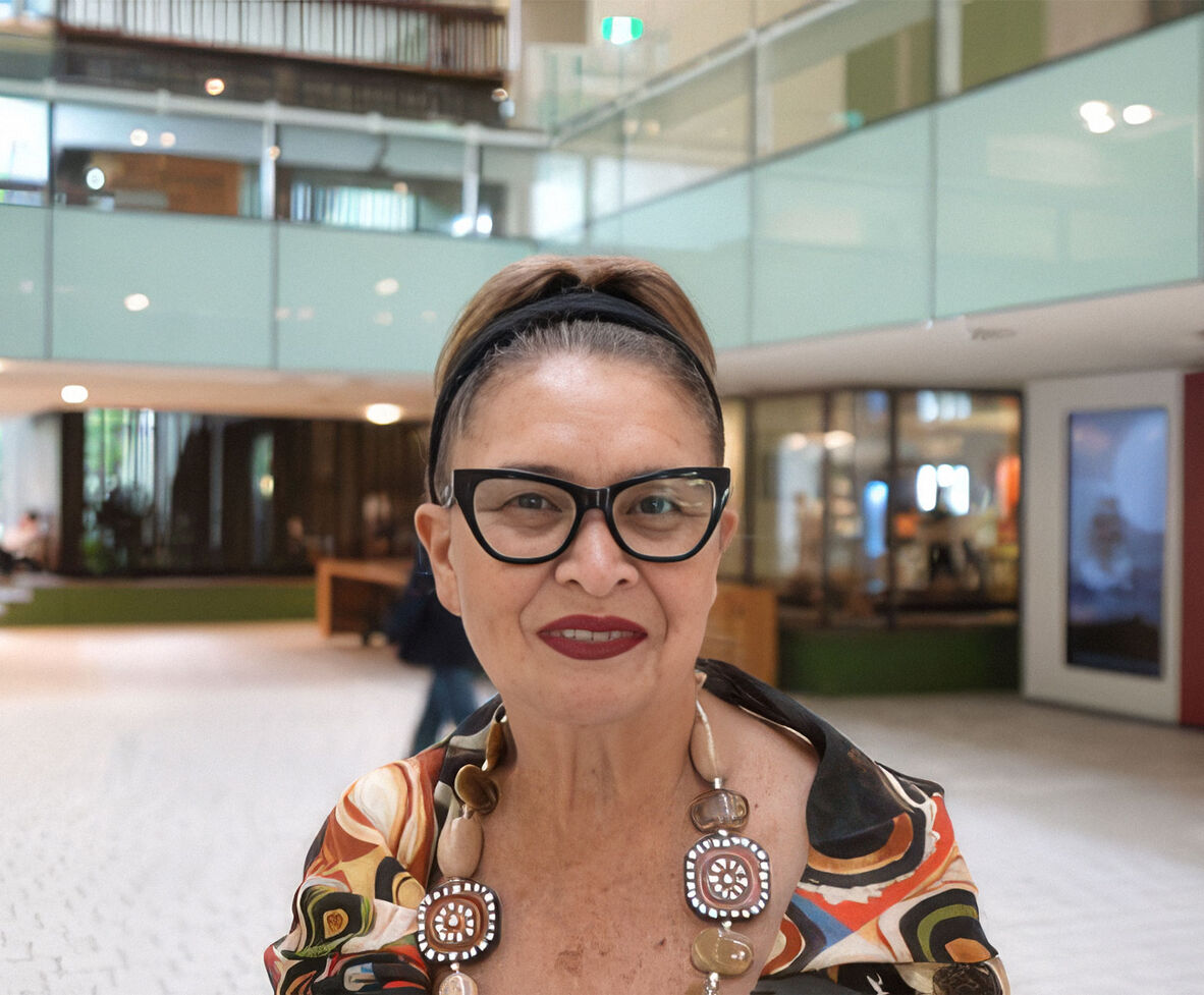 Woman smiling towards camera.