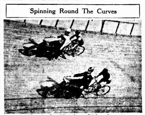 Black-and-white newspaper image titled “Spinning Round The Curves,” showing cyclists racing on a steeply banked velodrome track. Riders lean sharply into the curve, closely grouped, suggesting high speed and competition.