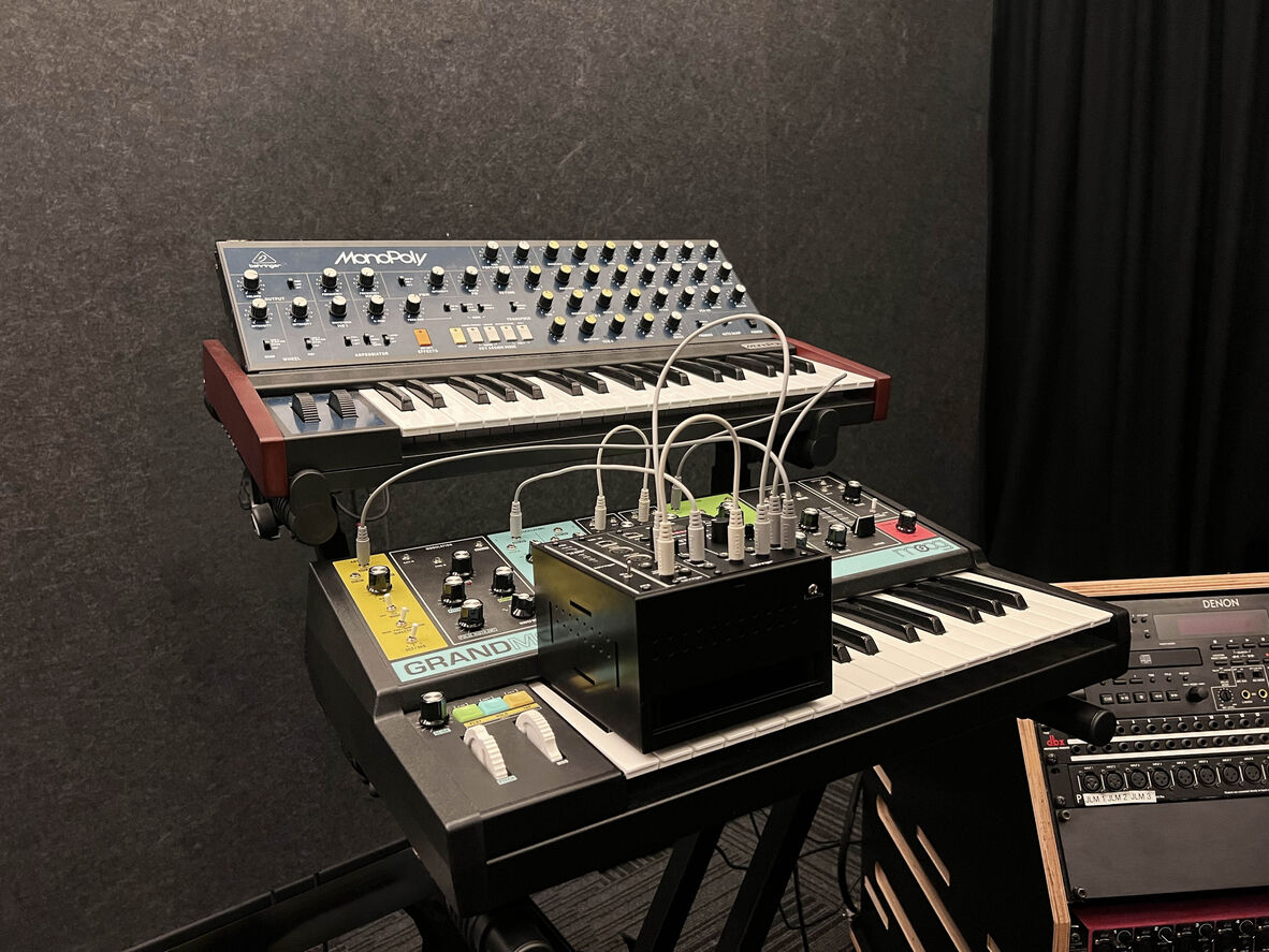 A Moog Grandmother and MonoPoly synthesiser.