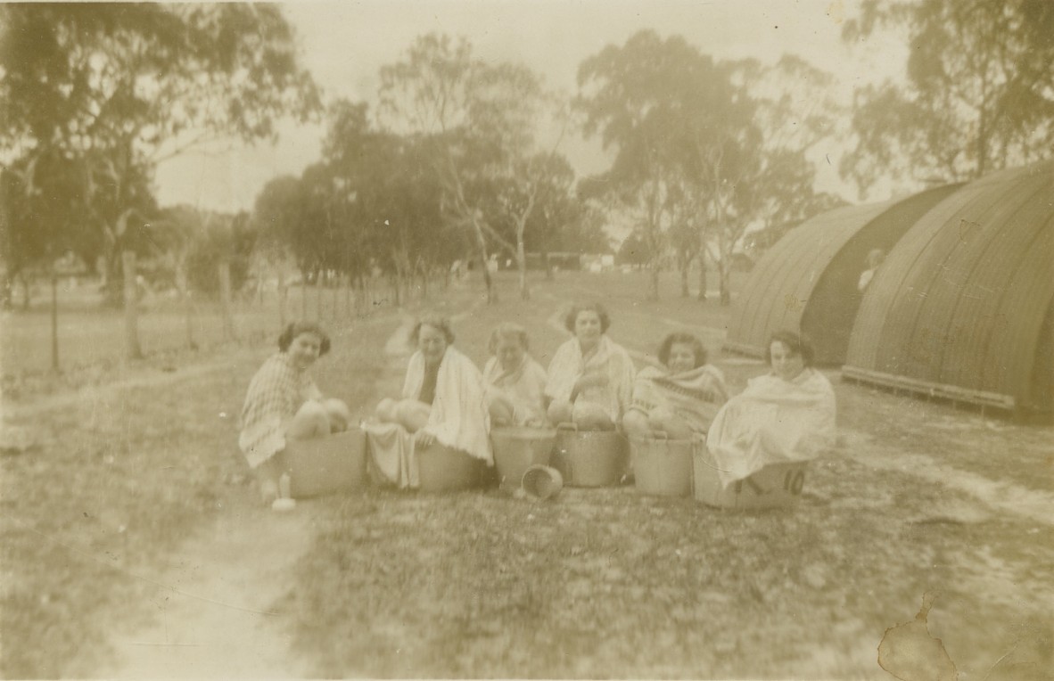 Women from the Australian Women's Army Service bathing in tubs at the 3rd Advanced Ordnance Depot, Wallangarra, 1942
