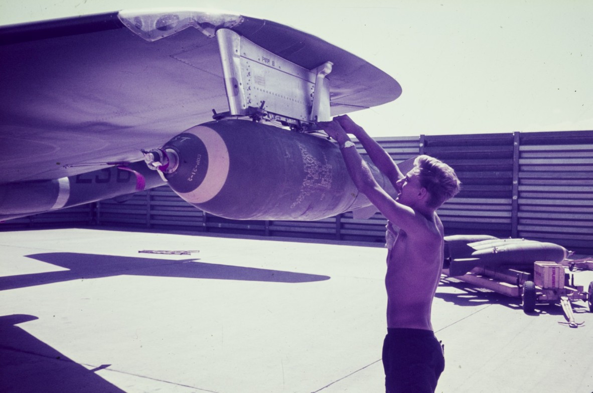 Preparing wing tip bombs and arming wires.