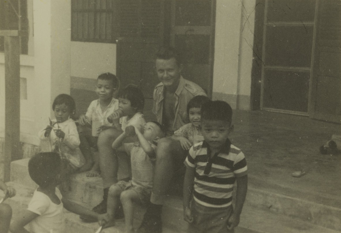 Jon Fallows with some of the children at Tan Tai Catholic Orphanage. 