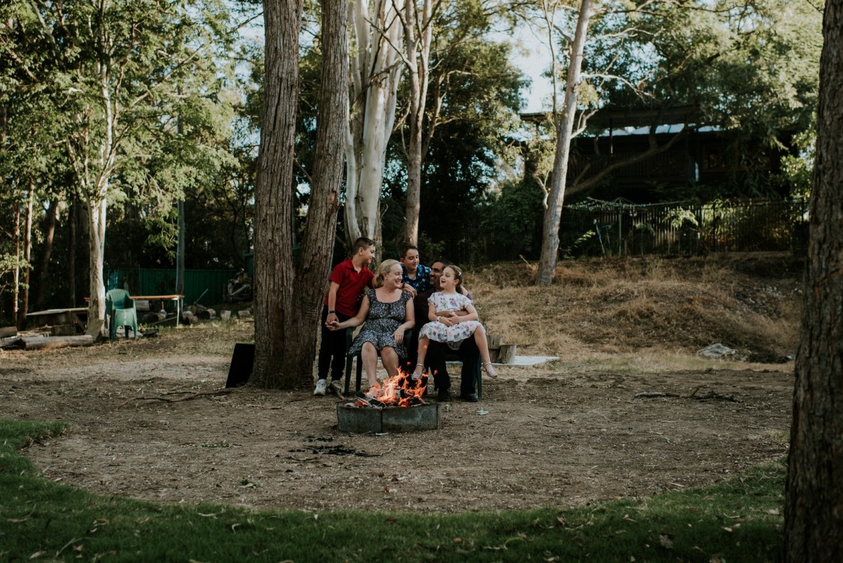 Jeurgen and Vicki Landmann sitting with their three children around a firepit during the height of COVID-19 restrictions in Brisbane April 2020.