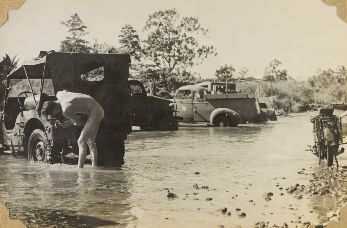 Washing vehicles in Hagita Creek, Milne Bay, Papua New Guinea, 1943