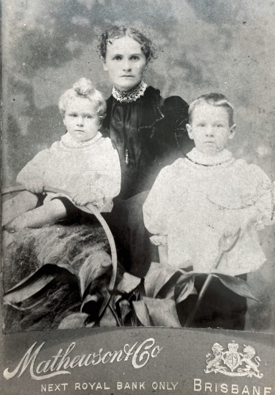 Copy of studio portrait, George Weeks (seated) with his brother and their mother Annie.