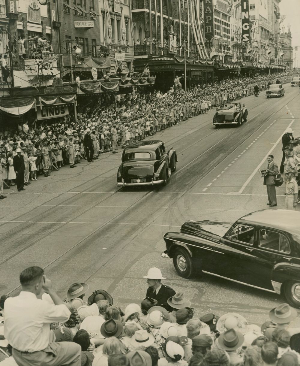 Large crowds line the streets as the royal entourage drives past, Queensland, 1954