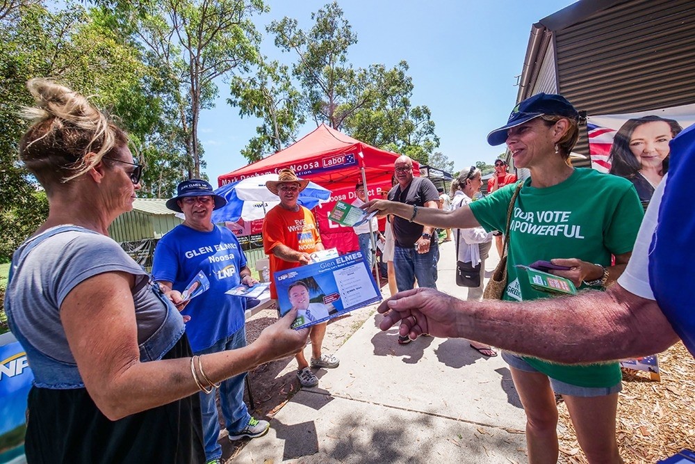 Political parties handing out how-to-vote cards at Sunshine Beach State School polling station, Sunshine Beach, Queensland, 25 November, 2017